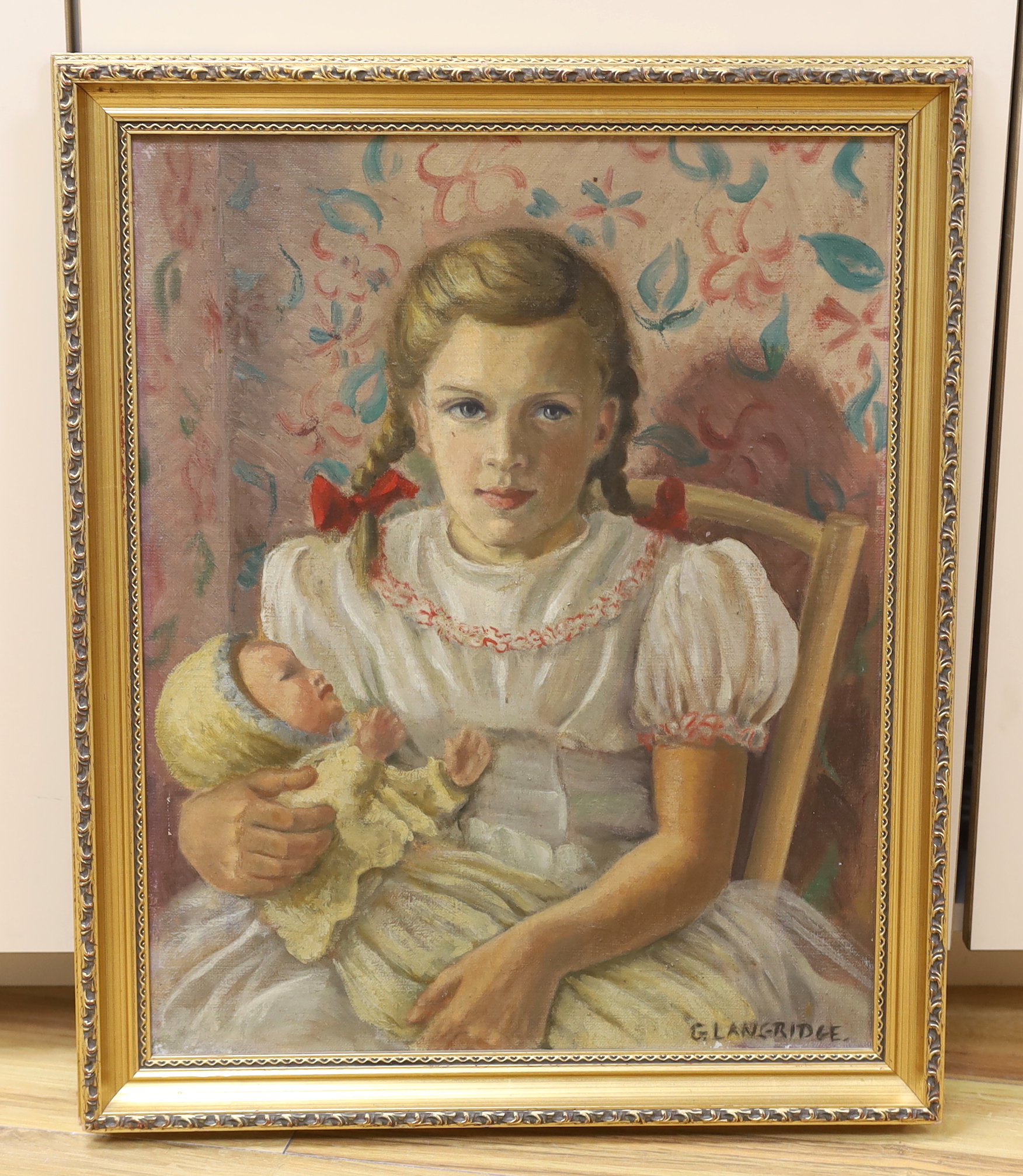 G. Langridge, oil on canvas, Portrait of a girl holding a doll, signed, 50 x 40cm